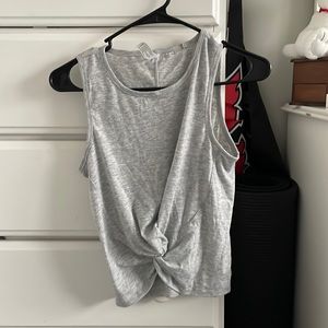 Grey tank top with a twist at bottom